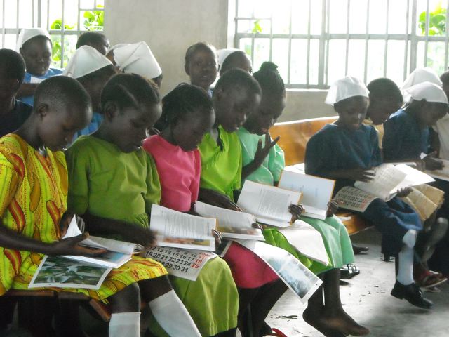 Orphans are thrilled to look at their new Christmas gift, a 101 Favorite Bible story book. Orphans are thrilled to look at their new Christmas gift, a 101 Favorite Bible story book.